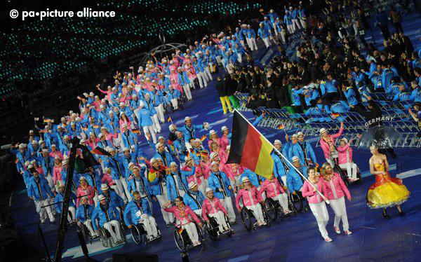 Germany's flag bearer Daniela Schulte (front) leads the team during the Opening Ceremony of the London 2012 Paralympic Games at the Olympic stadium, London, Great Britain, 29 August 2012. Photo: Julian Stratenschulte dpa