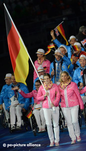 Germany's flag bearer Daniela Schulte (front) leads the team during the Opening Ceremony of the London 2012 Paralympic Games at the Olympic stadium, London, Great Britain, 29 August 2012. Photo: Julian Stratenschulte dpa