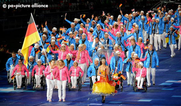 epa03374267 Germany's flag bearer Daniela Schulte leads the German delegation into the Olympic Stadium during the opening ceremony of the London 2012 Paralympic Games, London, Britain, 29 August 2012. EPA/FACUNDO ARRIZABALAGA