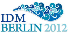 Logo der IDM 2012 - Aufsch&auml;umende Wellen und Schriftzug IDM BERLIN 2012